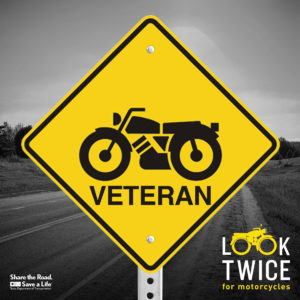 Image of a warning sign with "Look Twice: Veteran" and motorcycle icon