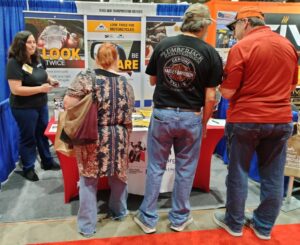 Attendees of the Houston RV show standing in front of the Look Learn Live booth.