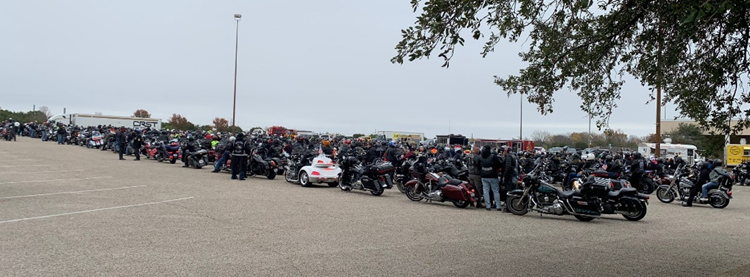 Motorcycles lined up outside the event.