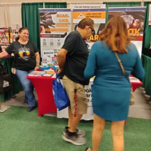 Guests stand in front of the Look Learn Live booth.